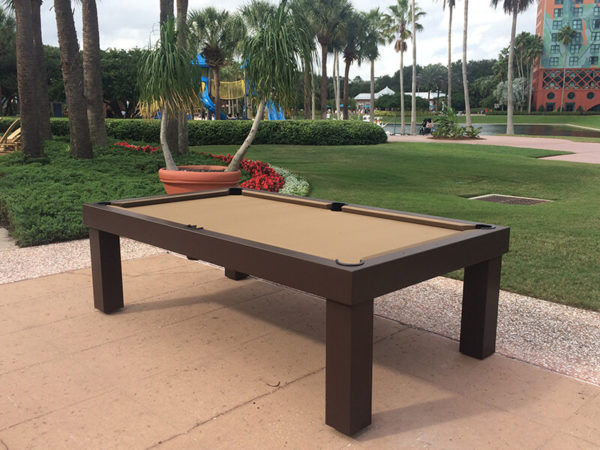 A pool table sitting on top of a patio.