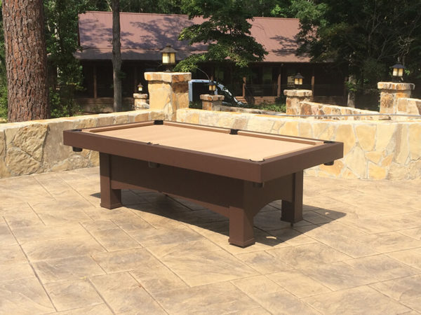 A pool table in the middle of an outdoor patio.