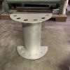 A metal pillar with holes for the base.