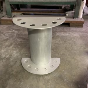 A metal pillar with holes for the base.