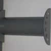 A metal pole with holes in it sitting on the wall.
