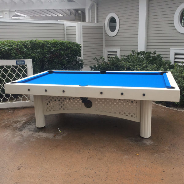 A pool table with blue cloth on top of it.